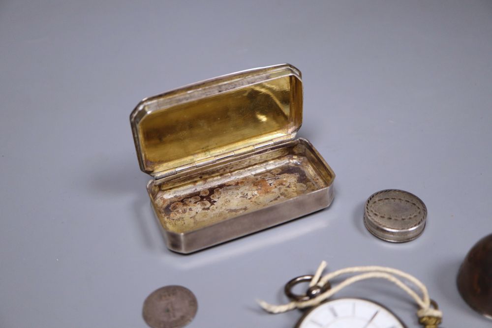 A French white metal snuff box, two other boxes including egg shaped, a Russian spoon, silver fob watch and a coin.